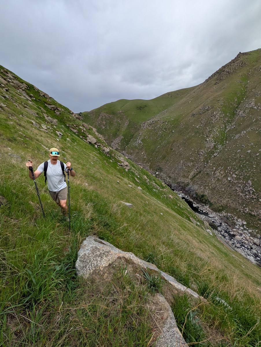 Hiker climbing steep trail above the Kern River